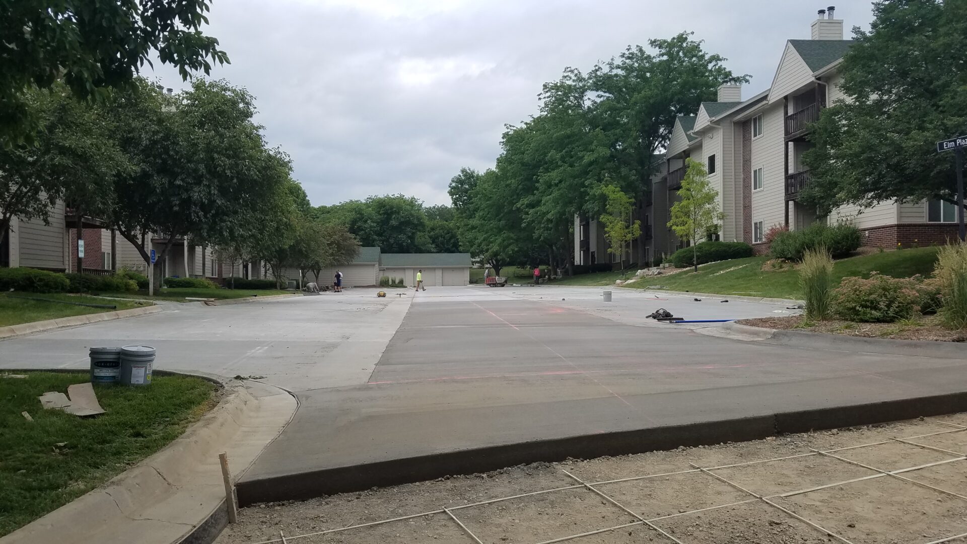 A concrete slab that has been laid in the middle of a driveway.